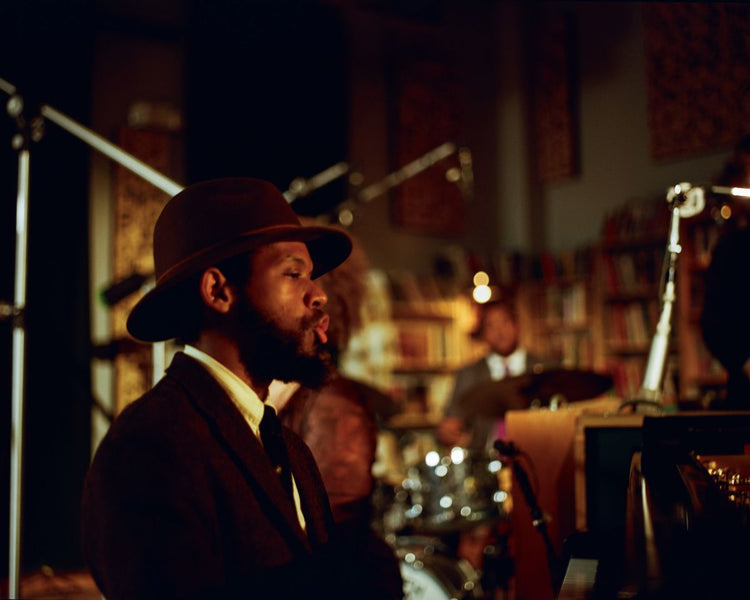 Sean Mason playing piano in the recording studio